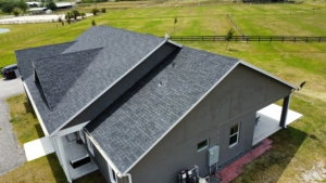 A modern architectural asphalt shingle roof located in South Florida.